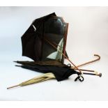 Four early 20th century lady's parasols, to include, a folding example with brass hinged coupling