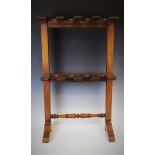 A Victorian mahogany boot rack, with two rows of four boot recesses to accommodate four pairs of