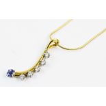 A diamond and sapphire set 18ct gold pendant, comprising an oval faceted sapphire measuring 5mm x