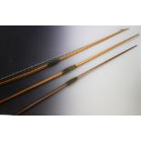 Three early 20th century ash archery bows, with padded velour hand grips, the longest 180cm (at