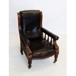 A William IV mahogany and leather drawing room chair, with a button padded back above padded arms
