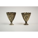 A pair of Turkish silver zarf, pre. 1923 mark, each of typical form and embossed with baskets of