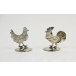 A pair of silver place card holders, Sampson Mordan & Co Ltd, Chester 1912, one designed as a