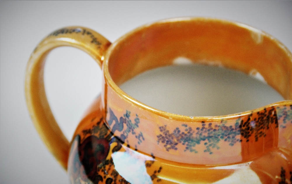 Three graduated Bursley ware Dragon pattern lustre jugs by Frederick Rhead, applied with fiery - Image 3 of 4