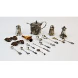 A selection of silver and silver coloured items, to include, a pair of Edwardian silver pepperettes,