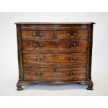 A George III mahogany serpentine chest of drawers, the moulded top above a sliding brushing tray,