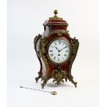 A late 19th century French boulle bracket clock, of bombe form with a spherical brass finial above a