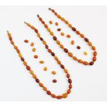 A butterscotch amber bead necklace, comprising thirty five untested amber beads, 53cm long, together