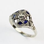 An Art Deco diamond and sapphire ring, comprising a central single cut diamond with a border