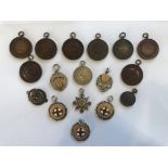 A collection of early 20th century silver and assorted sporting medals, to include examples for