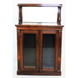 A mid 19th century rosewood chiffonier, with a galleried shelf above a mirrored back and a pair of