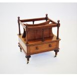 A Victorian mahogany Canterbury, with four spherical finials above a top rail, raised upon slender