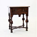 A William and Mary walnut side table of small proportions, the cross banded and quarter veneered top