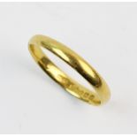 A 22ct gold wedding band, plain polished exterior, ring size L, weight 2.3gms