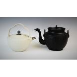 An early 19th century black basalt kettle and cover, the body with engine-turned reeding and griffin