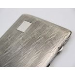 A silver cigarette case, John Rose, Birmingham 1943, of rectangular form, with striped and engine
