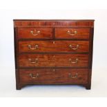 A George IV mahogany chest of drawers, the rectangular top above three faux frieze drawers and an