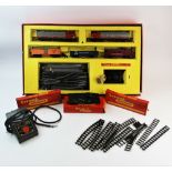 A boxed Triang electric model railroad set, a boxed Triang R138 snow plough, boxed model track
