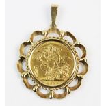 A George V sovereign, dated 1915, complete in a 9ct gold pierced design pendant mount, gross