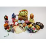 A collection of hand blown and hand painted chicken eggs, 20th century, each intricately decorated