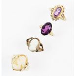 A 9ct gold amethyst set dress ring, comprising an oval mixed cut amethyst set to a yellow gold