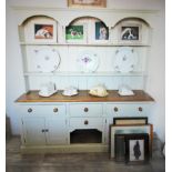 A Victorian style painted pine kitchen dresser, 20th century, the high back with an arcaded frieze