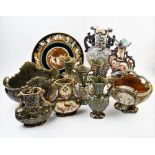 A collection of majolica wares, comprising, a moon flask decorated with shells and Greek mythical