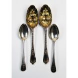 A pair of silver spoons, maker mark 'JJ', London 1739, with urn cast terminals and beaded rims, each