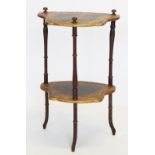 An Italian style two tier occasional table, 20th century, the upper tier adorned with a courting