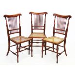 A set of three Victorian walnut bedroom chairs, each with a comb back above a rattan seat, upon