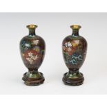 A pair of Chinese cloisonne vases, late 19th/early 20th century, each of baluster form, enamelled in