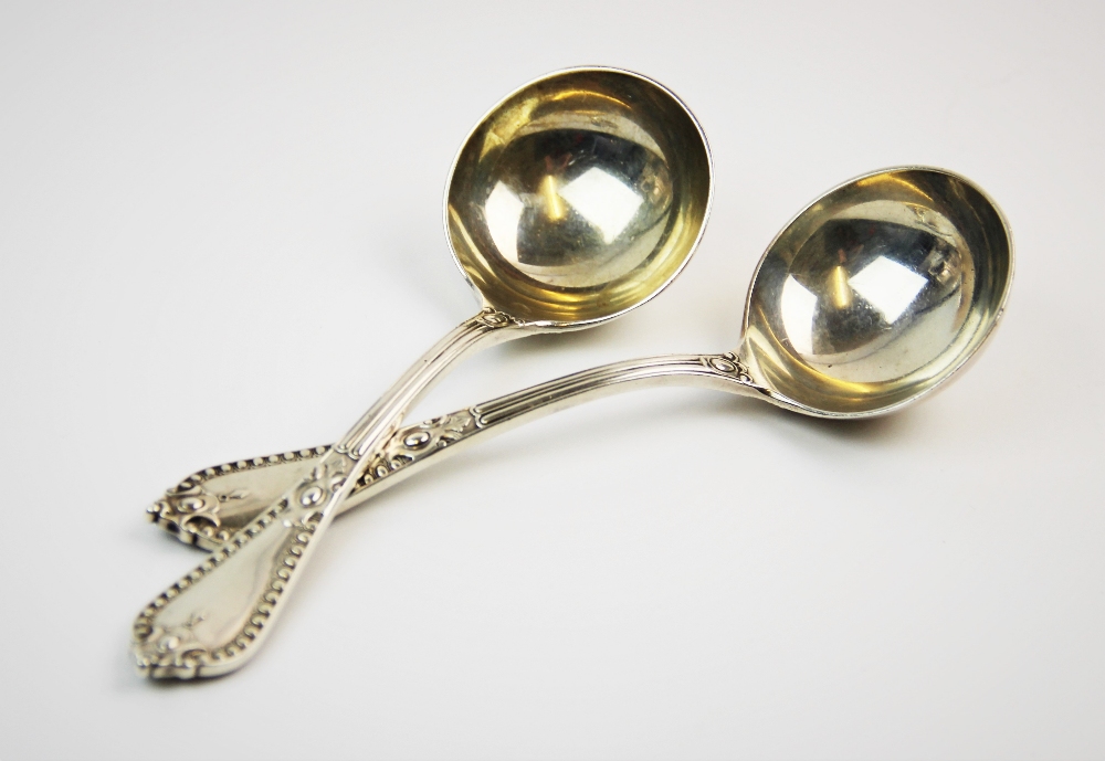 A pair of Victorian silver ladles, Goldsmiths' Alliance Ltd, London 1888, with plain polished bowls,