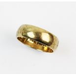 A 9ct gold wedding band, plain polished exterior, ring size S 1/2, weight 6.3gms