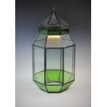 A 20th century leaded green glass terrarium, of octagonal form, with removable tapering cover, upper