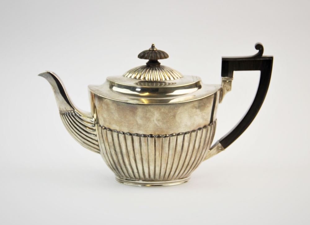 A Victorian silver teapot, Charles Stuart Harris, London 1888, of typical form, the half reeded body