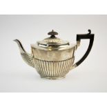 A Victorian silver teapot, Charles Stuart Harris, London 1888, of typical form, the half reeded body