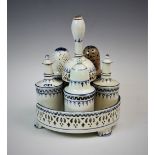 A Dutch cream ware cruet set, 18th century, comprising; oil bottle, vinegar bottle, sugar sifter,