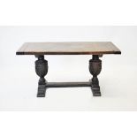 A 17th century style refectory table, early 20th century, the rectangular cleated slab top raised