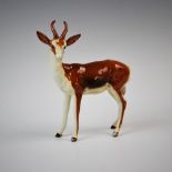 A Beswick model of a Springbok, no.1048, modelled in a standing position, head turned to the left,