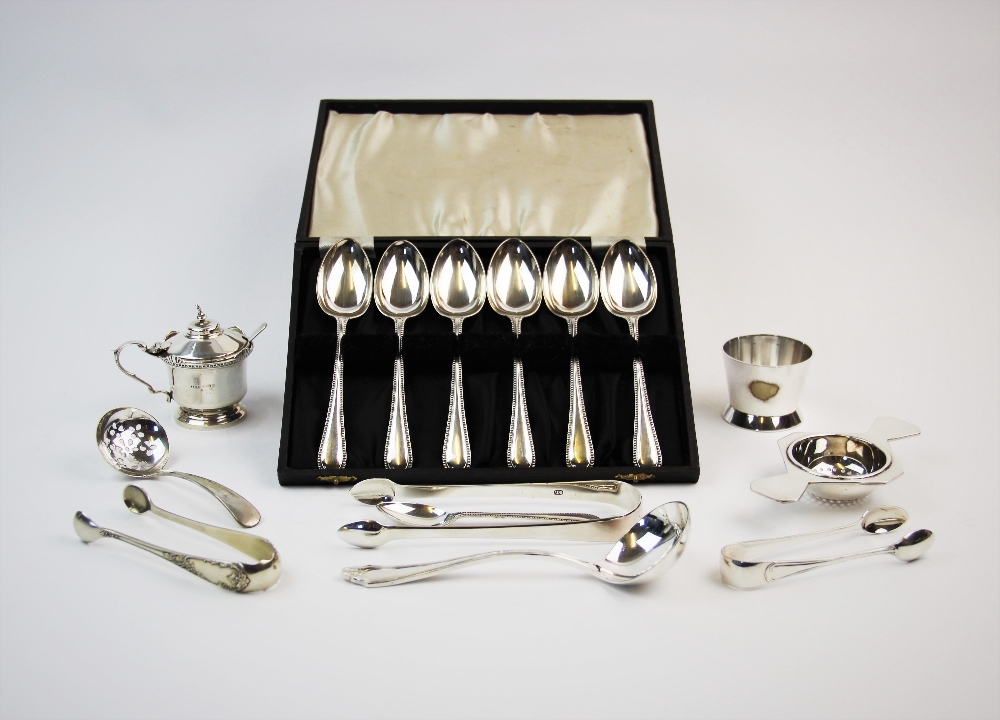 A selection of silver and silver coloured items, to include, a pair of George III silver sugar nips,