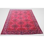 A red ground Persian Qashqai carpet, with all over design, 300cm x 212cm