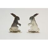 A pair of silver place card holders, Sampson Mordan & Co Ltd, Chester 1912, each designed as a