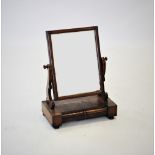 A Victorian mahogany dressing table mirror, the rectangular mirrored plate within a plain frame,