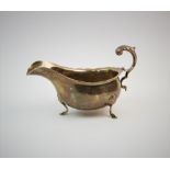A silver sauce boat, F C Richards, Birmingham 1945, of typical plain polished form, with scalloped