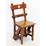 A Victorian walnut child's metamorphic chair, converting to library stepladders, with Gothic