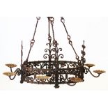 A wrought iron hanging chandelier, 20th century, of oval open work form, applied with four pairs