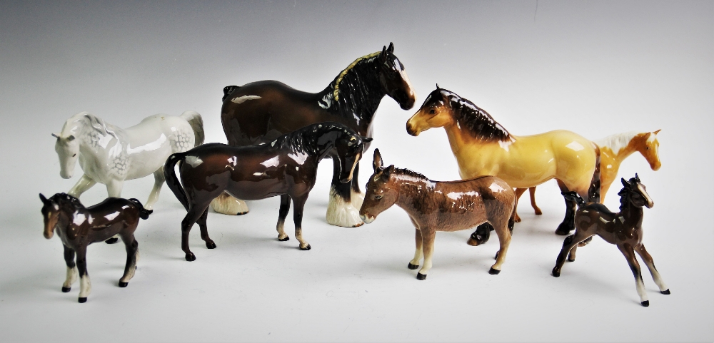 Eight Beswick horse figures to include a grey pony, right leg raised, model no.1549, a bay