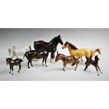 Eight Beswick horse figures to include a grey pony, right leg raised, model no.1549, a bay