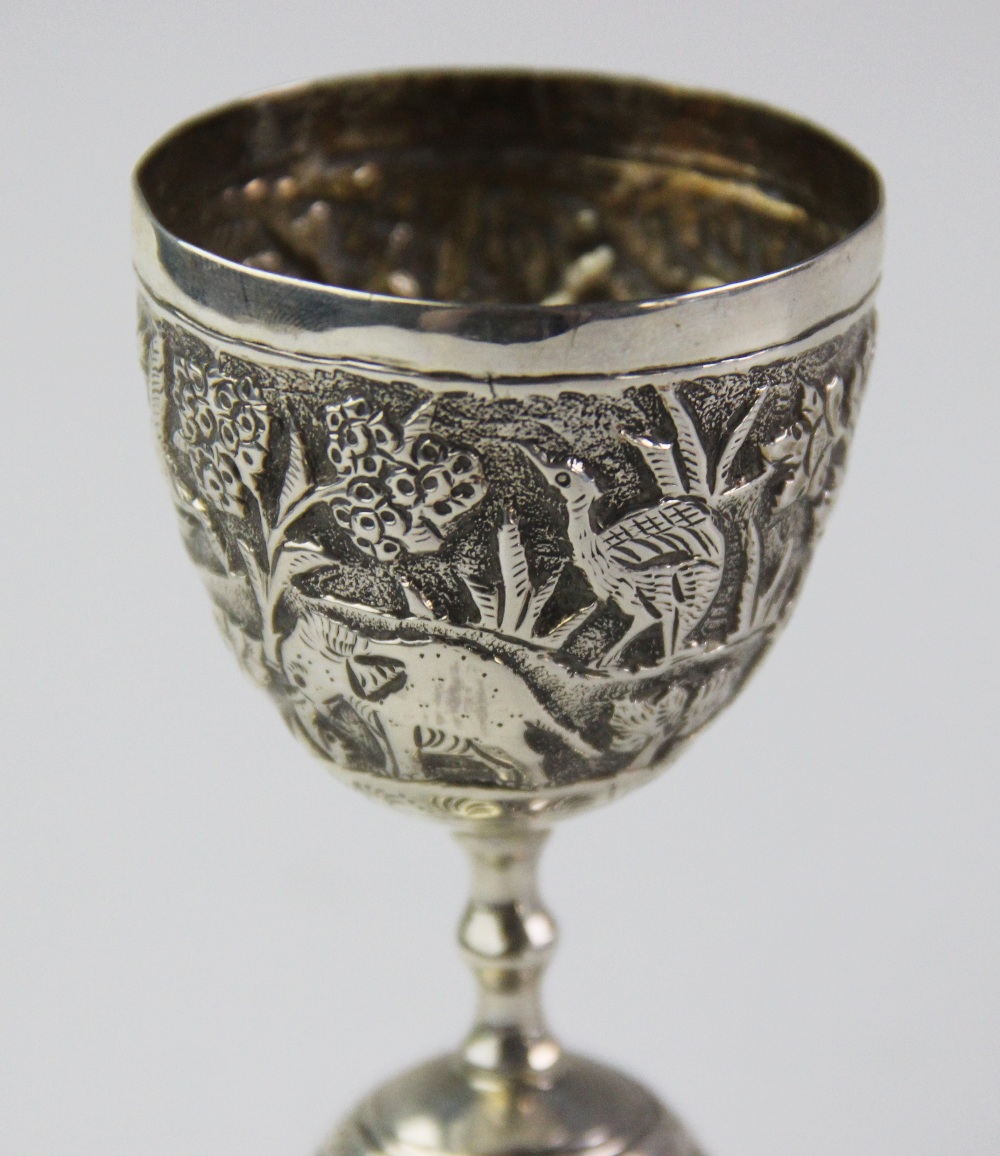 An Anglo-Indian silver double egg or wager cup, each bowl chased with a continuing landscape of - Image 3 of 4