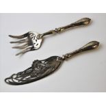 A pair of continental Art Nouveau fish servers, each finely pierced with pinks and scrolling